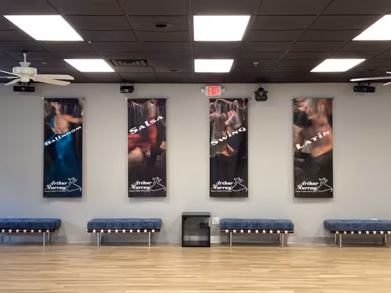 Arthur Murray posters on the wall in the Princeton dance studio.